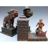 Three vintage novelty cast iron money boxes comprising 'Artillery Bank', 'Ole Puffer' and 'Bull