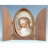 A late 19th/20thC Meissen porcelain plaque in brass frame, hand decorated with Christ and crown of
