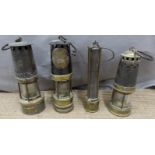 Four various miner's lamps, one by Ackroyd & Best and another G.T.Riches & Co. Ltd Orno, height of