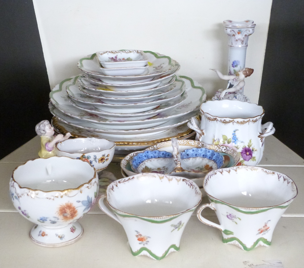 A collection of continental ceramics including a good selection of decorative Dresden dinner and tea