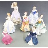 Seven Royal Doulton and Coalport figurines including 'Free as the Wind' from the Reflection