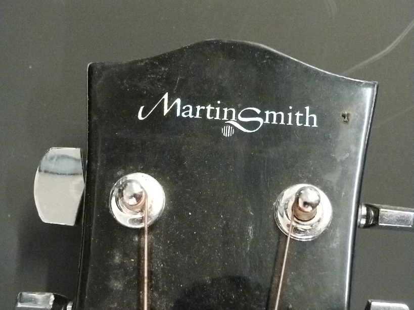 Two acoustic guitars comprising a Martin Smith in flame effect and a Chantry example in black - Image 2 of 4