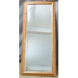 Bevelled edge pine framed mirror, overall size 134 x 58cm