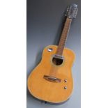 Twelve string acoustic guitar with fitted pick-up, in natural finish