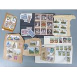 A large collection of all world stamps, loose and in envelopes
