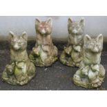 Four fox family garden ornaments, height 40cm