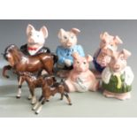 Five Wade Nat West pigs and three Beswick horses, tallest 18cm