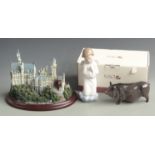 Lenox Great Castles of the World model 'Neuchwanstein', Doulton pig and a Nao figurine, tallest