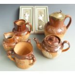 Royal Doulton and Doulton Lambeth stoneware jugs, tyg and teapot and a pair of continental relief