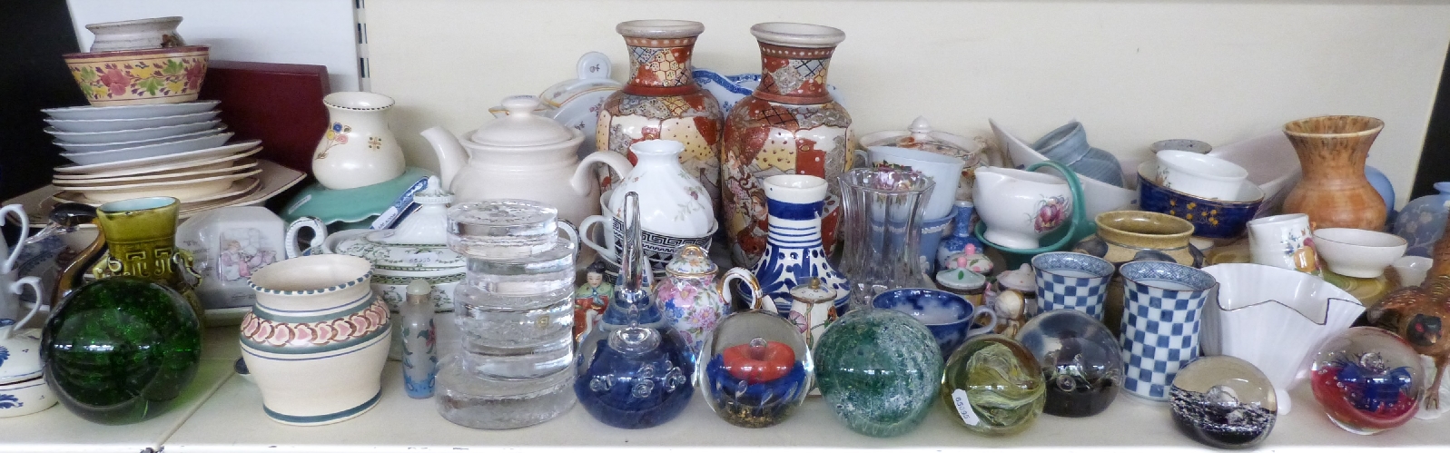 A large collection of ceramics including three teapots, Royal Doulton dessert set, paperweights,