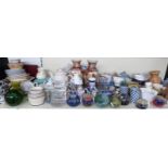 A large collection of ceramics including three teapots, Royal Doulton dessert set, paperweights,