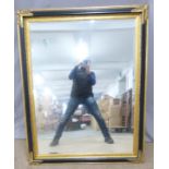 A large over mantel mirror with black and gilt frame, overall size 110 x 140cm