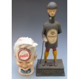Two cast iron novelty advertising money boxes for Coca Cola and Guinness, tallest 34cm