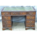 Twin pedestal leather inset desk with nine drawers, W121 x D62 x H75cm