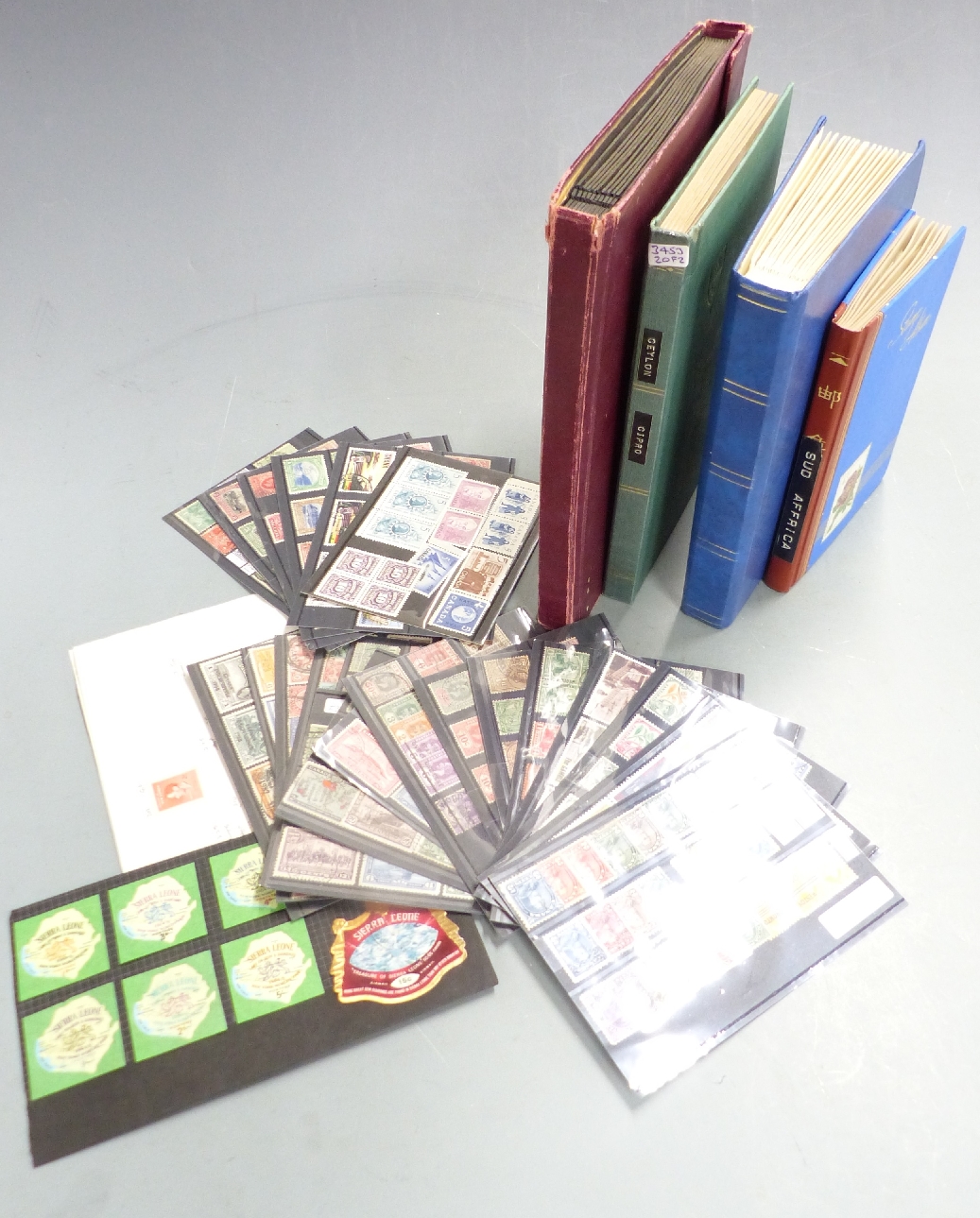 Four small stockbooks and stockcards of Commonwealth stamps, all periods