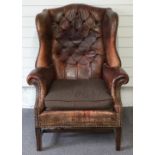 Leather Chesterfield wing back armchair