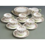 Shelley part tea set comprising six trios, milk and cake plate all decorated with vines, shape no