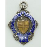 A hallmarked silver fob set with enamel reading 'Marylebone & Paddington District' verso engraved '