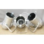 Three polished aluminium stage/industrial lights