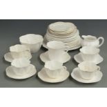 Approximately 32 Shelley and Foley tea ware with moulded leaf decoration, reg no 272101