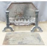 A cast iron fire back, grate and andirons, width of grate 60cm