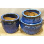 Three blue glazed garden plant pots, diameter of largest 45cm