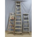 Three vintage wooden step ladders, tallest 230cm