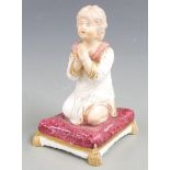 Bloor Derby figurine of a girl praying, raised on a tasselled plinth, H 9.5cm