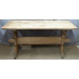 Pine rustic table raised on sleigh type legs united by stretcher, L163 x D89 x H76cm