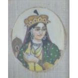 A 19thC Indian ivory portrait miniature of a lady with headdress, 8 x 6cm, in period frame