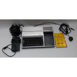 Texas Instruments TI - 99/4A computer with accessories and handbook