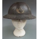 British Army WW1 steel Brodie helmet with regimental insignia to front for the King's Shropshire
