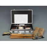 A twenty-four piece shotgun and rifle cleaning kit in fitted case together with a brass shotgun