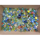 Collection of vintage glass marbles including some with multi-coloured twists, largest 34mm in