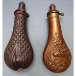 Two copper and brass powder flasks, one G Roe with embossed scene featuring a dog to both sides (