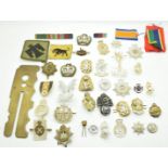 Small collection of British Army metal and anodised badges including Royal Anglican, Royal Irish