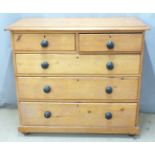 19thC pine chest of two over three graduated drawers raised on bun feet, W109 x D52 x H96.5cm