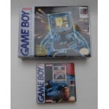 Nintendo Game Boy hand held video games console, in original box together with three games Star Trek