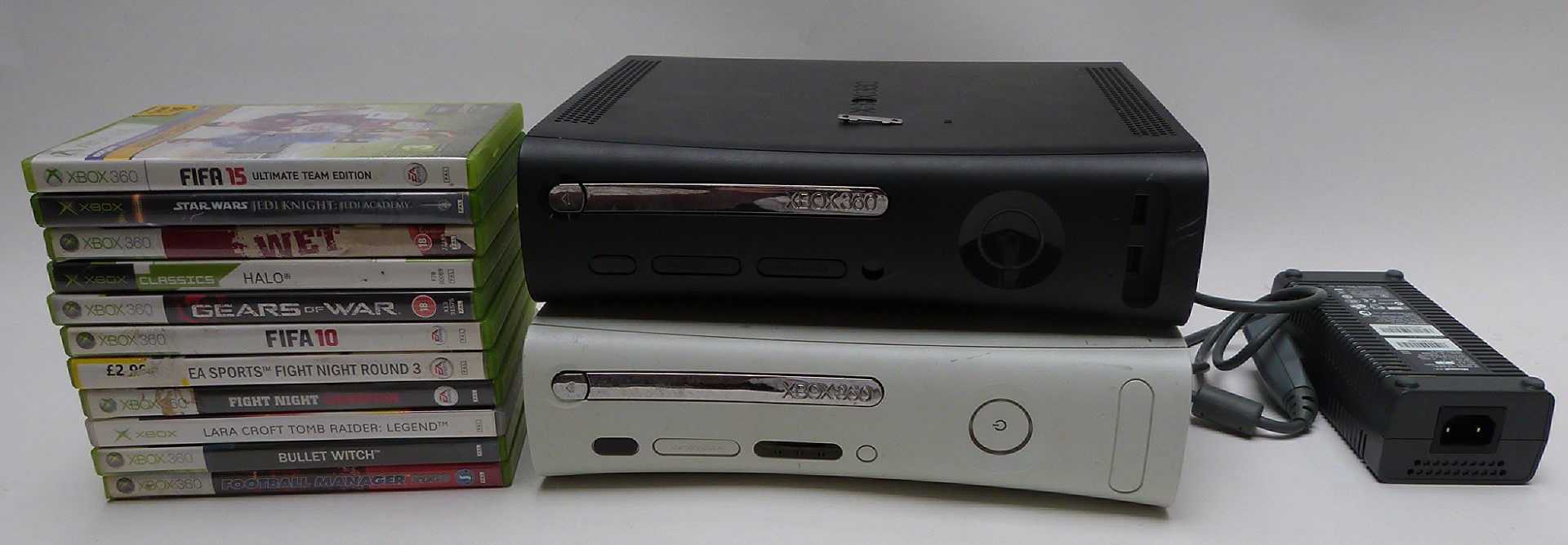 Two Xbox 360 video games consoles together with 11 various games.