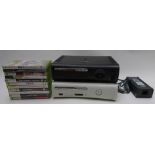 Two Xbox 360 video games consoles together with 11 various games.