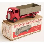 Dinky Supertoys diecast model Guy 4-ton Lorry with red cab, chassis and hubs and fawn bed, 511, in