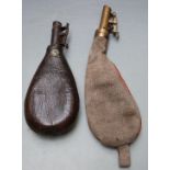 Two shot flasks, one canvas and leather with brass top the other leather with metal top, largest