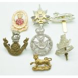 Six British Army metal badges including hallmarked silver Officers Light Infantry, Yorkshire