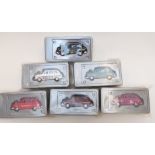 Six The Beatles album cover diecast model taxis, all sealed in original packaging.