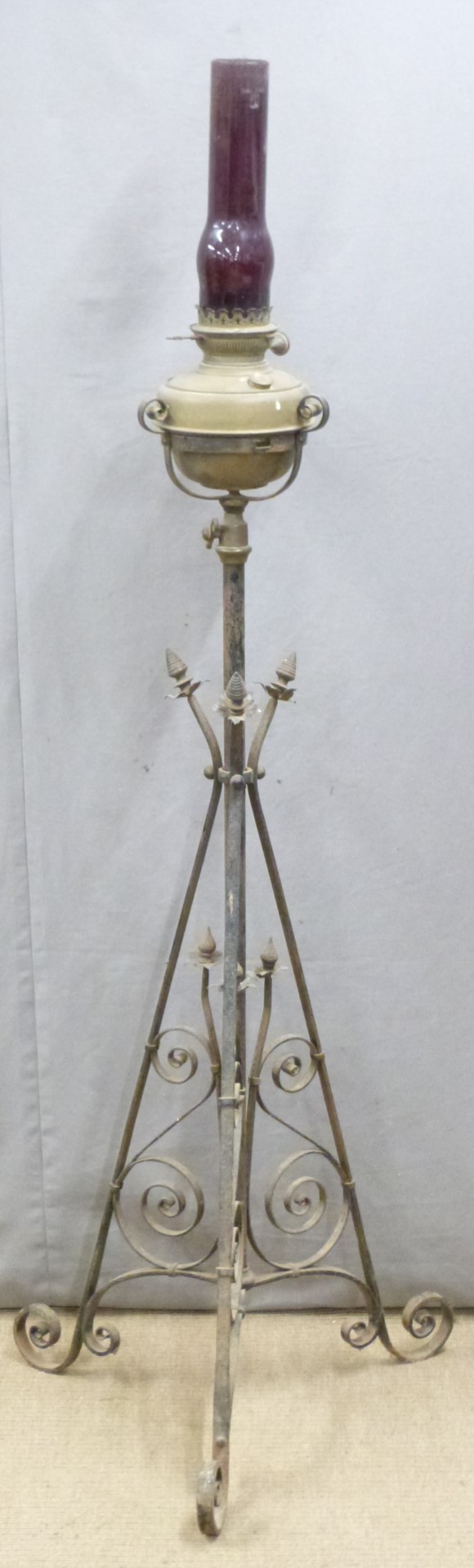 Arts and Crafts wrought iron and brass extendable oil lamp, H165cm