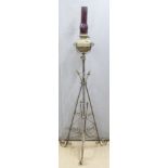 Arts and Crafts wrought iron and brass extendable oil lamp, H165cm