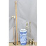A blue and white stick stand and sticks including ivory handled, chestnut thumb stick, companion set