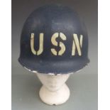 Military helmet painted with USN to front and Pearl Harbour references