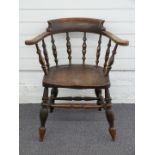 An elm seated elbow chair, H77cm