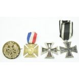 Two German Iron Crosses, one WW1 the other WW2, together with a Queen Victoria Diamond Jubilee Cross